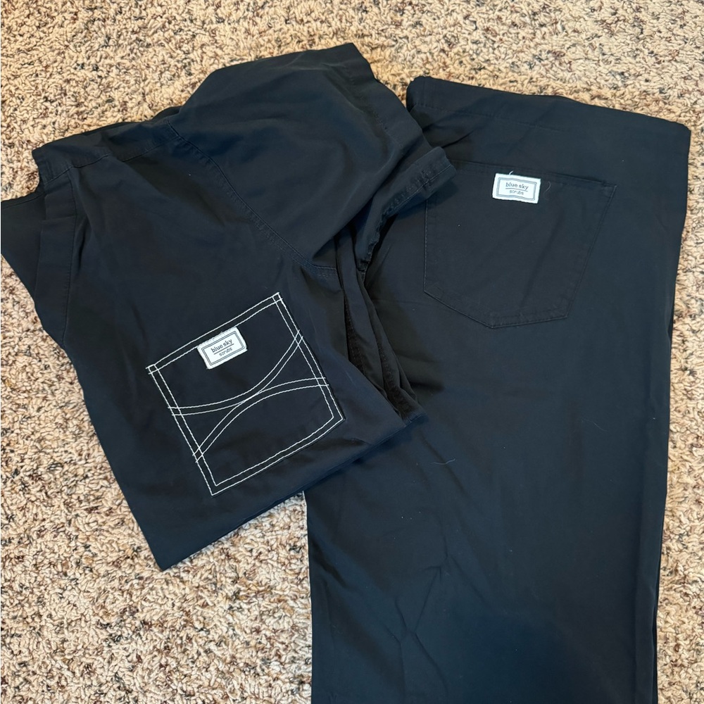 Blue sky scrubs set in black.